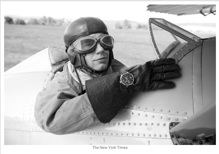 pilot in open cockpit plane